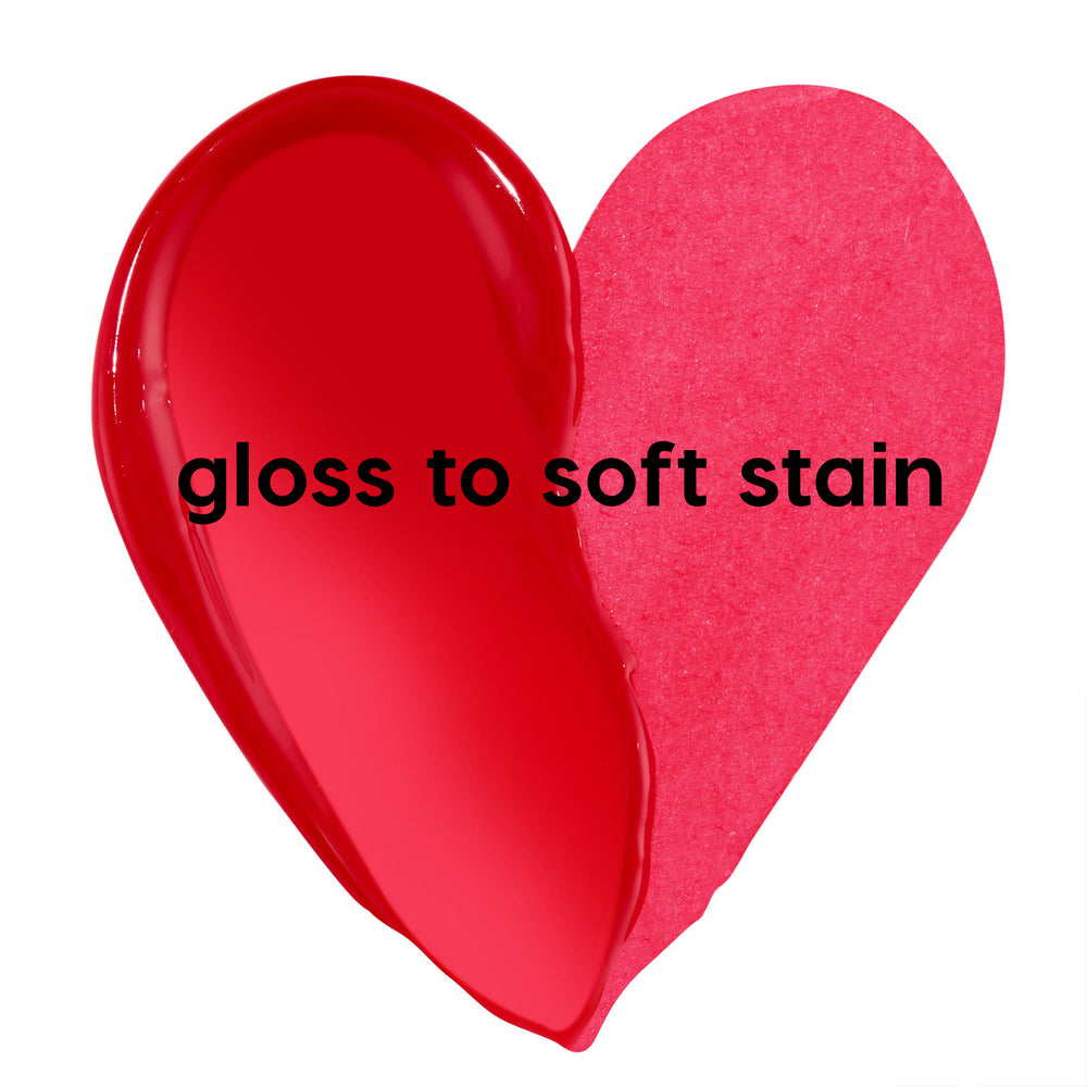 Fruit Punch ColourPop Lip Stain swatch shaped like a heart, left side glossy cherry red labeled 'gloss it', right side matte hot pink labeled 'stain it', on a white background.