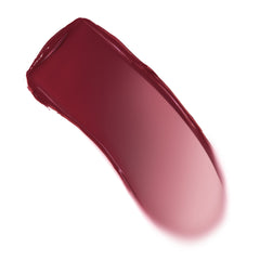 Creamy swatch arcs across a white background, showing a deep berry-wine to soft rose gradient with a dewy sheen - ColourPop Lip and Cheek Balm in Ravished, highlighting buildable pigment for lips and cheeks.