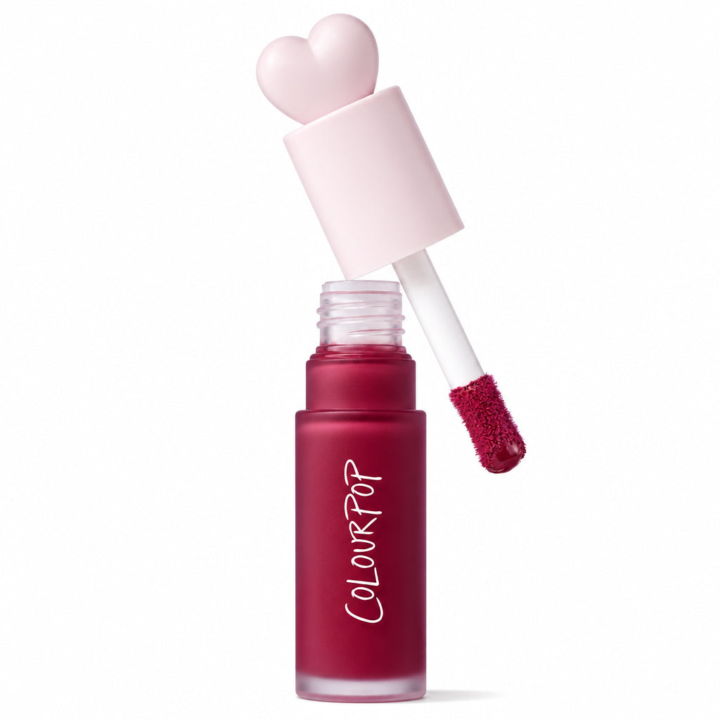 ColourPop Liquid Blush Royal Flush displayed open, doe-foot applicator lifting a berry-red tint from a frosted bottle labeled COLOURPOP, pink heart-shaped cap beside it, with a red Allure Best of Beauty 2025 award badge on a white background.
