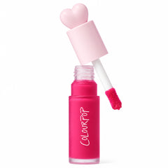 ColourPop Liquid Blush in Wildest Dreams, cap off - heart-shaped pale pink cap and doe-foot applicator hovering over a frosted hot pink bottle, with an Allure Best of Beauty 2025 award badge on the right against a white background.
