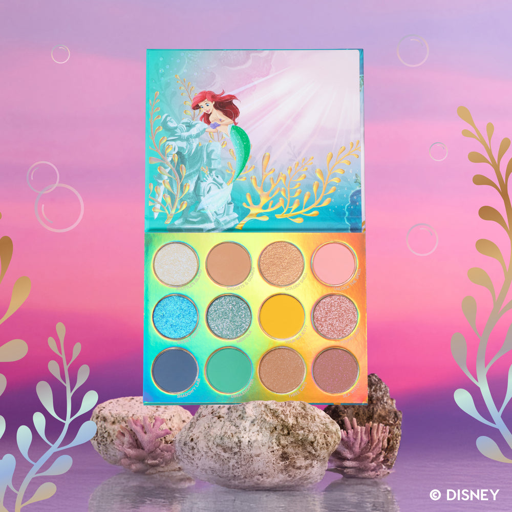 Under the Sea Eyeshadow Palette open on a coral reef set, Ariel artwork on the lid