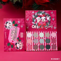 A Very Mickey Christmas Eyeshadow Palette open beside its red Mickey and Minnie wreath packaging