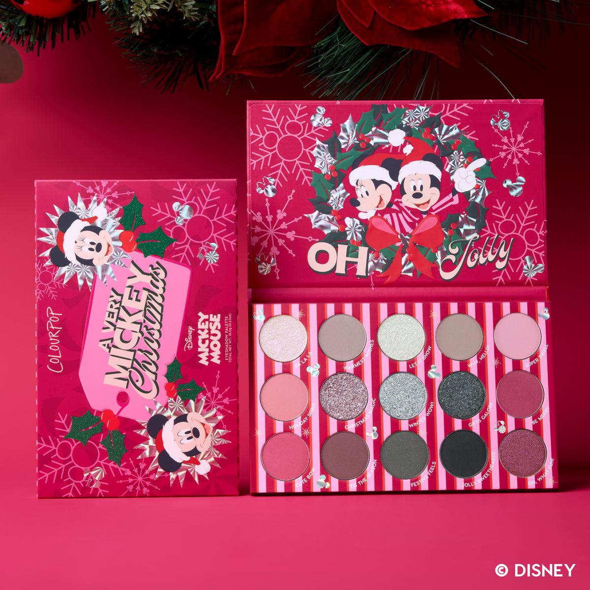 A Very Mickey Christmas Eyeshadow Palette open beside its red Mickey and Minnie wreath packaging