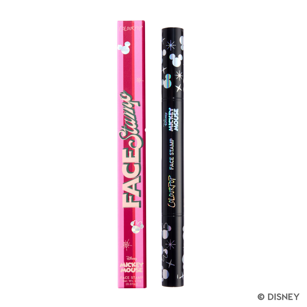 Merry Mickey Face Stamp in its pink Face Stamp box, with the black dual-ended stamp beside it