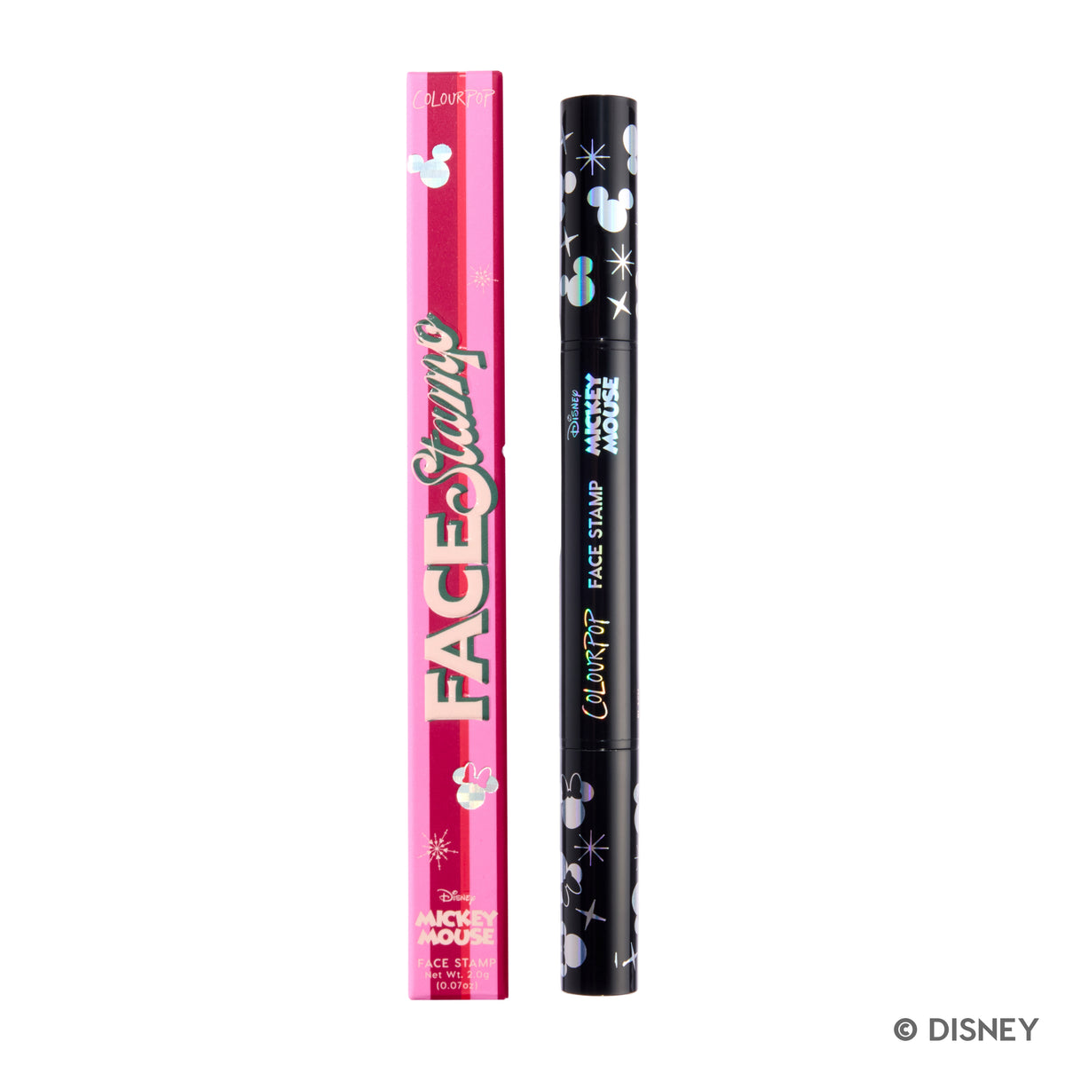 Merry Mickey Face Stamp in its pink Face Stamp box, with the black dual-ended stamp beside it