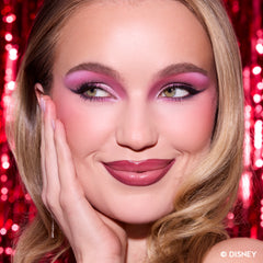 Model with fair skin wearing pink and mauve eyeshadow with a berry lip from A Very Mickey Christmas