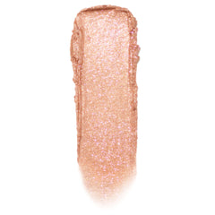 Shimmering rose‑gold peach swipe with fine pink sparkle shows Mystical Jelly Much Shadow texture on a white background, highlighting its glossy-to-metallic payoff; ColourPop Jelly Much Shadow single eyeshadow swatch.