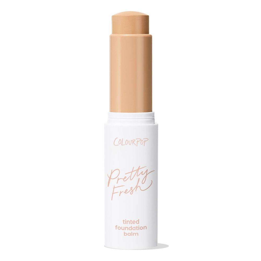 ColourPop Pretty Fresh Tinted Foundation Balm in Light 6 extends from a white twist-up tube with peach Pretty Fresh script, cap off, revealing a light beige stick ready for swipe-on coverage on a clean white background.