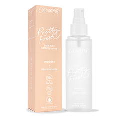 ColourPop Pretty Fresh Setting Spray Lock It In bottle stands beside a peach box on white, a frosted 3.4 fl oz mister with peptides and niacinamide, offering 16-hour wear, transfer-proof, waterproof makeup hold.