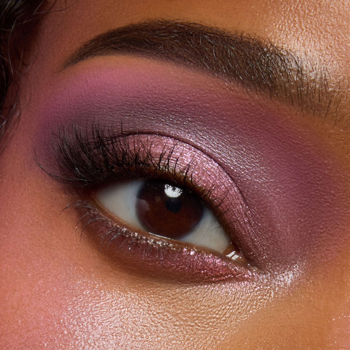 Close-up of a deep-skin eye with rosy mauve and pink shimmer from the Pink Dreams palette