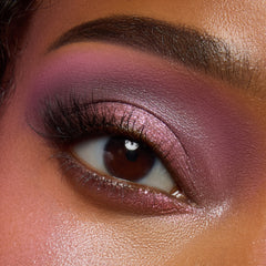 Close-up of a deep-skin eye with rosy mauve and pink shimmer from the Pink Dreams palette