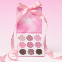 Pink Dreams eyeshadow palette open under its pink ribbon-tied box