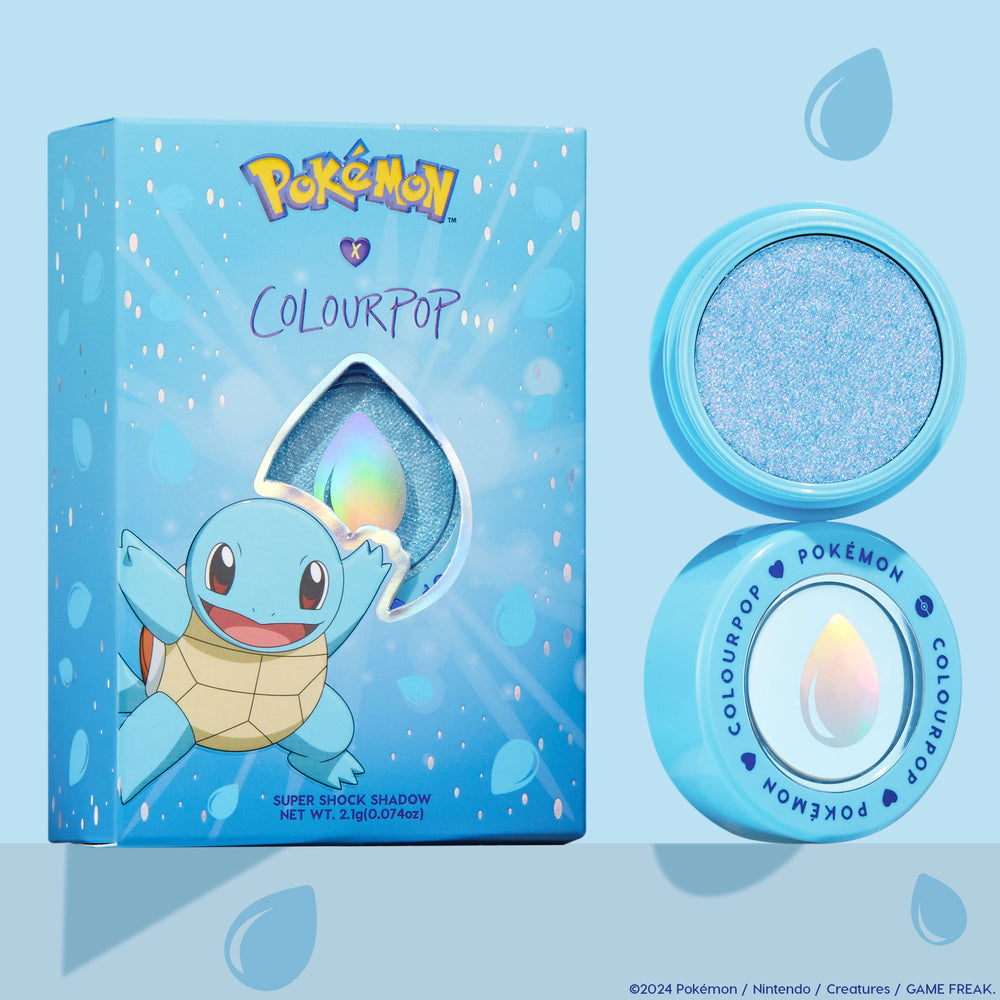 Hydro Pump ColourPop Super Shock Shadow, a shimmery icy blue eyeshadow, sits in an open baby-blue pot beside its Pokémon x ColourPop box featuring Squirtle and a water-drop cutout, highlighting the sparkly shade.