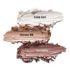 Metallic Neutrals ColourPop Shadow Stix swatches - Cold Girl (icy pearl), Honey BB (champagne gold), Socialite (rosy taupe) - smeared in thick, shimmery strokes on a white background.