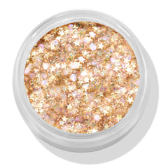 Open jar of ColourPop Glitter Gel, Spinner shade, displaying dense champagne-gold glitter with iridescent flecks and tiny gold star sequins in a clear round pot, viewed top-down on a white background.
