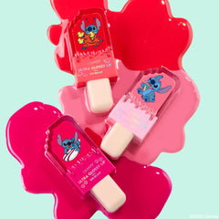 ColourPop Keepin’ It Sweet Ultra Glossy Lip trio shaped like popsicles featuring Disney Lilo and Stitch artwork, arranged on bright melted pink gloss pools against a mint background for a fun summer lip gloss display.
