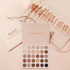 Doin’ the Most ColourPop Shadow Palette & Brush Set featuring the Bare Necessities 30‑pan neutral palette open with matte and shimmer nudes to deep browns, paired with a blush brush roll of white, rose‑gold brushes on a soft pink background with $175 value badge.