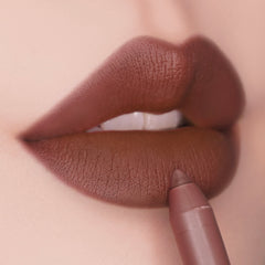 ColourPop Lippie Pencil in CTRL lines full lips, the creamy nude-brown shade gliding along the lower lip to define a matte pout; close-up highlights the precise tip and smooth, full-coverage finish.
