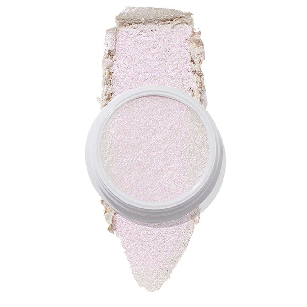 ColourPop Spellbound Super Shock Highlighter in a white pot, displaying an iridescent pink-lilac glow, with a broad swatch stroke beneath the pan showing its soft, shimmery payoff on a clean white background.