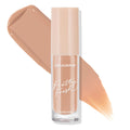 ColourPop Pretty Fresh Creamy Concealer in Medium Dark 113 C stands upright as warm medium‑dark beige swatches sweep behind it on a white background, highlighting the hyaluronic creamy formula and clear tube with nude cap.