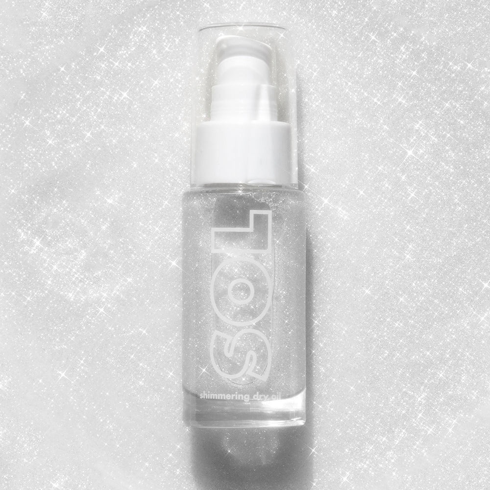 Clear pump bottle of ColourPop SOL Shimmering Dry Oil in Sterling Silver stands upright, showcasing fine silver shimmer and the SOL logo against a glittering white background.