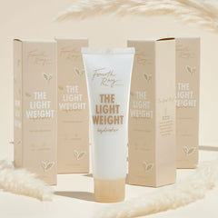 Fourth Ray Beauty The Lightweight hydrator tube standing upright, a ColourPop Face Moisturizer, gold lettering, 1.7 fl oz, surrounded by matching beige cartons and soft pampas accents on a warm cream backdrop.