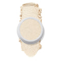 ColourPop Stole the Show Super Shock Highlighter in a round white pot sits atop a thick champagne‑pearl swatch on a white background, showing its luminous shimmer finish for face highlighting.