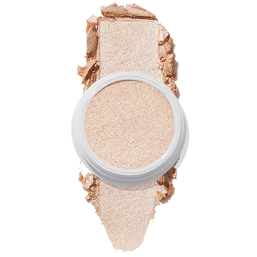ColourPop Super Shock Highlighter Flexitarian swatched in a reflective icy champagne tone, the creamy formula pressed in a white pot with a bold swipe above and below on a white background, showing high-impact shimmer.