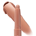 ColourPop Shadow Stix Bare With Me glides a rosy nude cream eyeshadow swatch behind a twist-up stick, highlighting the rounded tip and smooth payoff on a white background.
