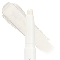 Cold Girl ColourPop Shadow Stix standing upright with its twist-up bullet exposed, showing an icy pearl white shimmer; a broad swatch of the creamy eyeshadow sits behind on a clean white background.