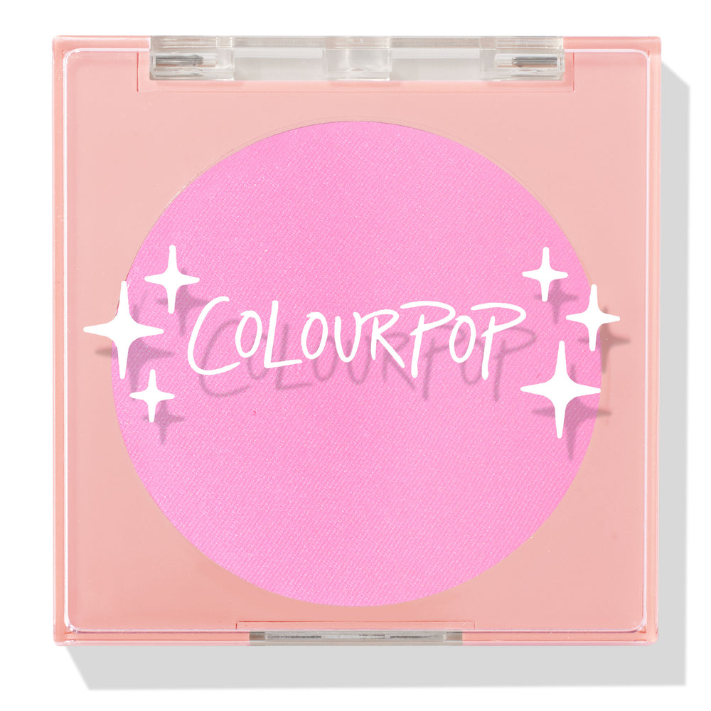 ColourPop Pressed Powder Blush in Flamingo shows a vibrant hot pink pan inside a square peach compact with a clear lid and white sparkles logo, closed and travel-friendly on a light background.