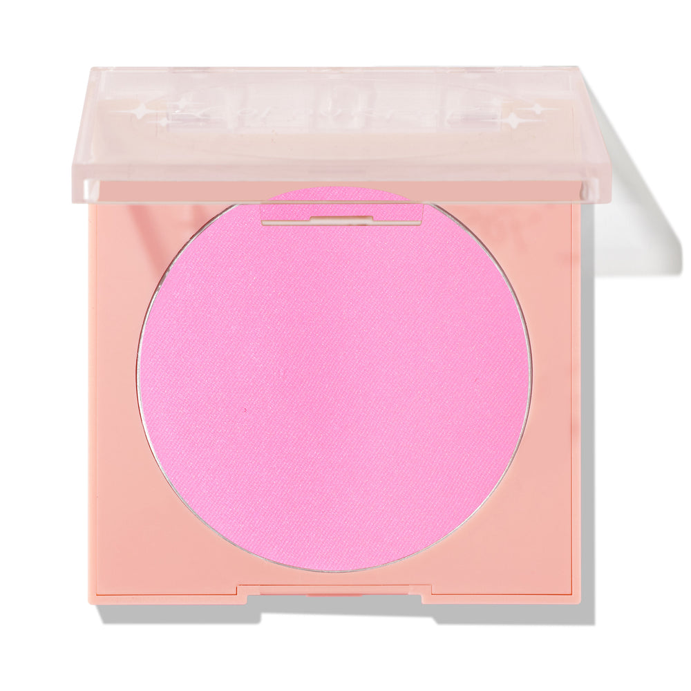 Flamingo shade shown in a peach square compact with a translucent lid half closed, revealing a bright bubblegum pink ColourPop Pressed Powder Blush pan on a white background with a soft shadow.