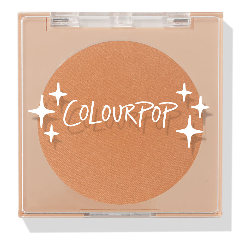 ColourPop Pressed Powder Bronzer in Silver Strand Beach, a warm tan matte shade, shown closed in a square clear compact with white ColourPop logo and star accents on the lid, displaying the full round pan in a sleek beige case.