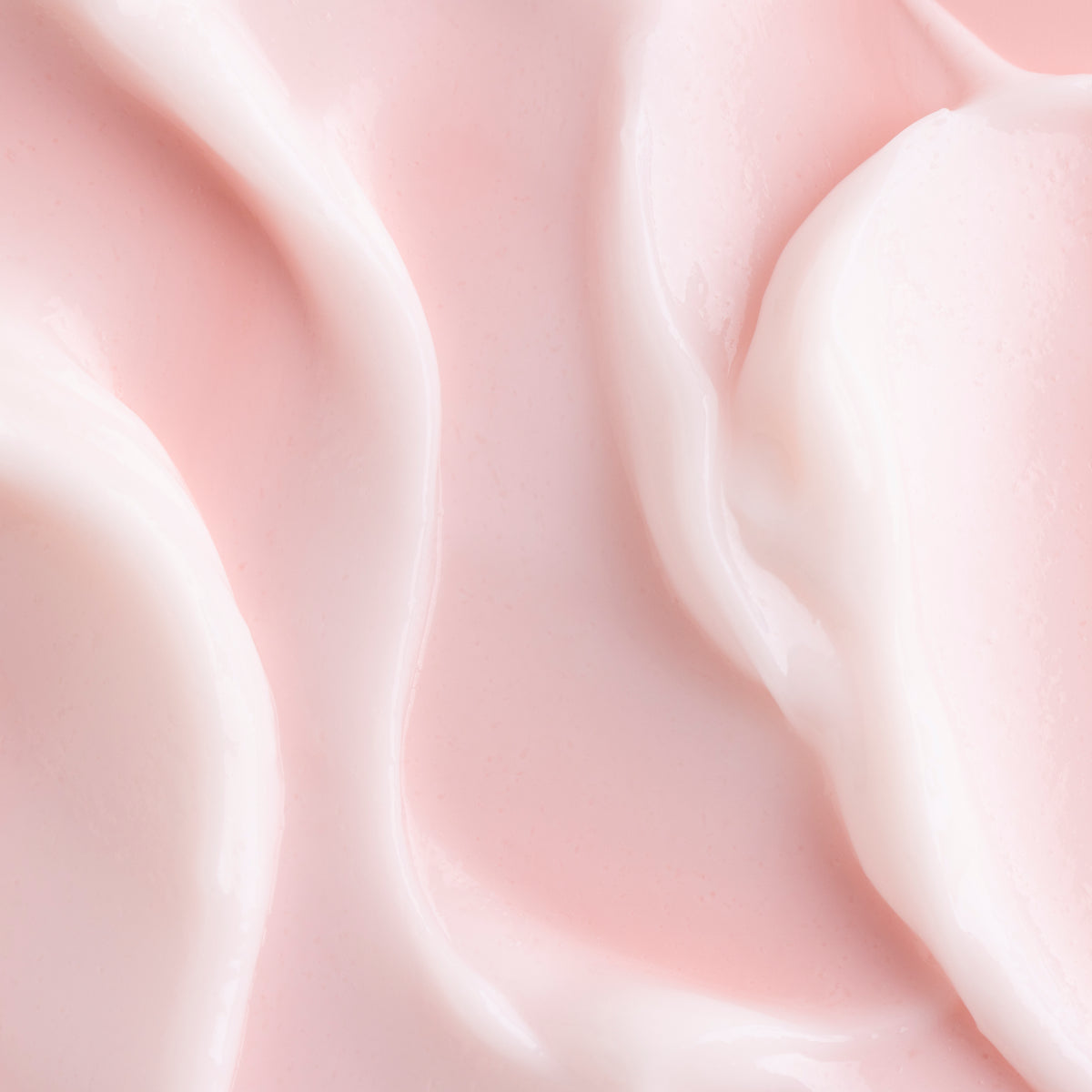 Good Mood Gel Moisturizer spread in glossy, pale pink swirls, showcasing the lightweight gel-cream texture of this ColourPop Face Moisturizer in a close-up on a smooth surface.